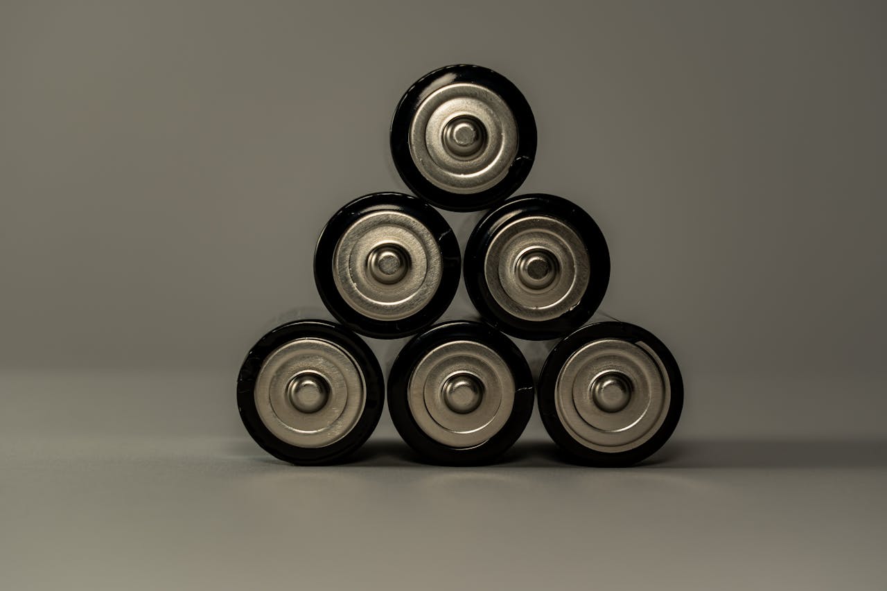 Mastering the First Impression: Your intriguing post title goes here Metallic AA batteries stacked in a pyramid shape, symbolizing power and energy storage.